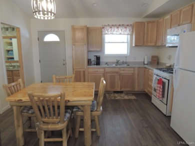 Just pack your bags and move right in to this immaculate totally on Nahma Club in Michigan - for sale on GolfHomes.com, golf home, golf lot