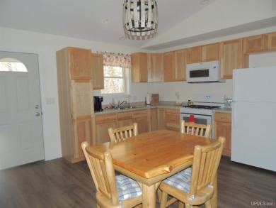Just pack your bags and move right in to this immaculate totally on Nahma Club in Michigan - for sale on GolfHomes.com, golf home, golf lot