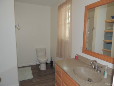 Just pack your bags and move right in to this immaculate totally on Nahma Club in Michigan - for sale on GolfHomes.com, golf home, golf lot