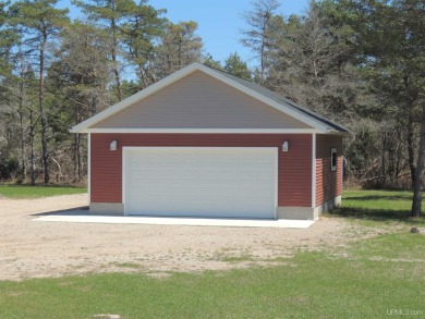 Just pack your bags and move right in to this immaculate totally on Nahma Club in Michigan - for sale on GolfHomes.com, golf home, golf lot