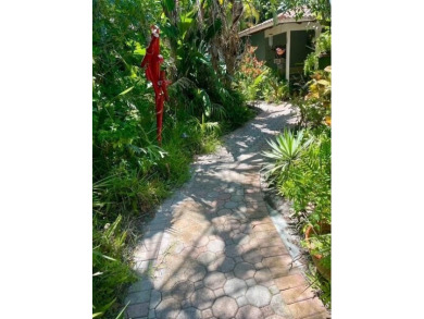 WONDERFUL FLORIDA STYLE COUNTRY CLUB SHORES canal FRONT home and on Links on Longboat Golf Club in Florida - for sale on GolfHomes.com, golf home, golf lot