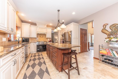 Custom-built 4-bedroom colonial set on a gorgeous 1-acre wooded on Stonebridge Golf Club in Michigan - for sale on GolfHomes.com, golf home, golf lot