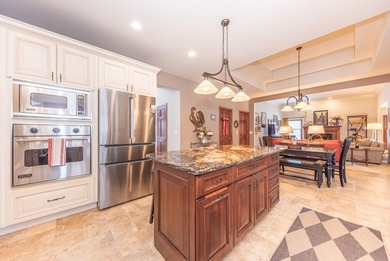 Custom-built 4-bedroom colonial set on a gorgeous 1-acre wooded on Stonebridge Golf Club in Michigan - for sale on GolfHomes.com, golf home, golf lot