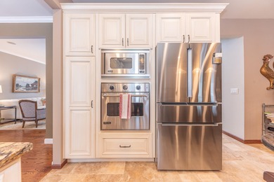 Custom-built 4-bedroom colonial set on a gorgeous 1-acre wooded on Stonebridge Golf Club in Michigan - for sale on GolfHomes.com, golf home, golf lot