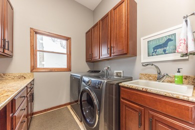 Custom-built 4-bedroom colonial set on a gorgeous 1-acre wooded on Stonebridge Golf Club in Michigan - for sale on GolfHomes.com, golf home, golf lot