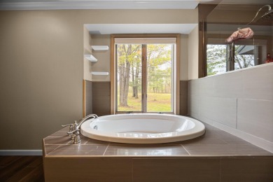 Welcome to this impeccably maintained ranch, ideally situated on on The Loon Golf Resort in Michigan - for sale on GolfHomes.com, golf home, golf lot