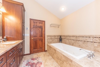 Custom-built 4-bedroom colonial set on a gorgeous 1-acre wooded on Stonebridge Golf Club in Michigan - for sale on GolfHomes.com, golf home, golf lot