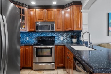 Step into a world of coastal luxury with this stunning 2BD, 2BA on Island Dunes Country Club in Florida - for sale on GolfHomes.com, golf home, golf lot