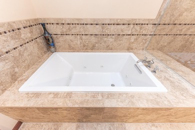 Custom-built 4-bedroom colonial set on a gorgeous 1-acre wooded on Stonebridge Golf Club in Michigan - for sale on GolfHomes.com, golf home, golf lot