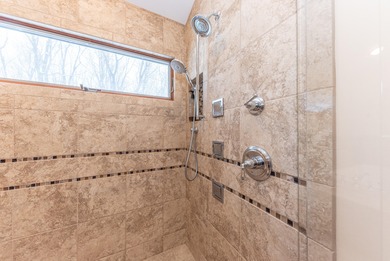 Custom-built 4-bedroom colonial set on a gorgeous 1-acre wooded on Stonebridge Golf Club in Michigan - for sale on GolfHomes.com, golf home, golf lot