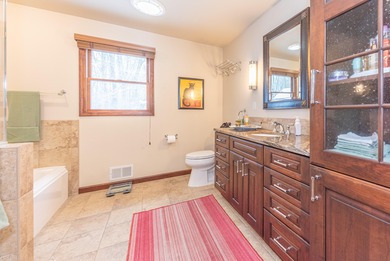 Custom-built 4-bedroom colonial set on a gorgeous 1-acre wooded on Stonebridge Golf Club in Michigan - for sale on GolfHomes.com, golf home, golf lot