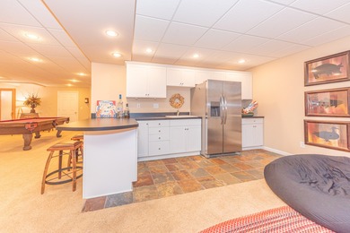 Custom-built 4-bedroom colonial set on a gorgeous 1-acre wooded on Stonebridge Golf Club in Michigan - for sale on GolfHomes.com, golf home, golf lot