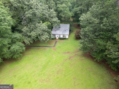 A hidden gem and rare opportunity right off the desirable on Indian Creek Golf Club in Georgia - for sale on GolfHomes.com, golf home, golf lot