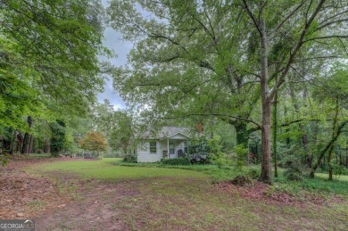 A hidden gem and rare opportunity right off the desirable on Indian Creek Golf Club in Georgia - for sale on GolfHomes.com, golf home, golf lot
