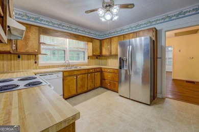 A hidden gem and rare opportunity right off the desirable on Indian Creek Golf Club in Georgia - for sale on GolfHomes.com, golf home, golf lot