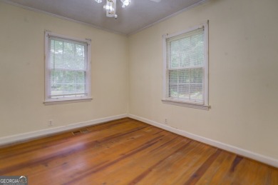 A hidden gem and rare opportunity right off the desirable on Indian Creek Golf Club in Georgia - for sale on GolfHomes.com, golf home, golf lot