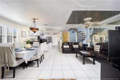 This residence boasts a spacious, open-concept design, perfectly on Island Dunes Country Club in Florida - for sale on GolfHomes.com, golf home, golf lot