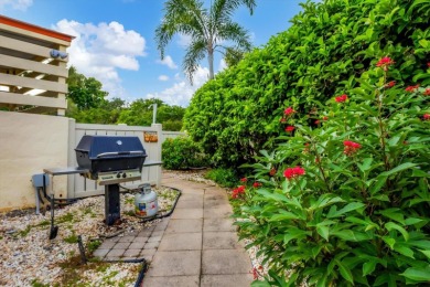 Waterfront End Unit with Breathtaking Sunsets & Natural Charm! on IMG Academies Golf and Country Club in Florida - for sale on GolfHomes.com, golf home, golf lot