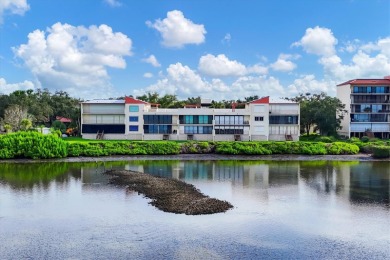 Waterfront End Unit with Breathtaking Sunsets & Natural Charm! on IMG Academies Golf and Country Club in Florida - for sale on GolfHomes.com, golf home, golf lot