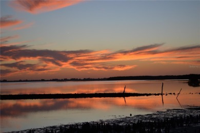 Waterfront End Unit with Breathtaking Sunsets & Natural Charm! on IMG Academies Golf and Country Club in Florida - for sale on GolfHomes.com, golf home, golf lot
