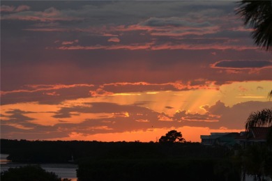 Waterfront End Unit with Breathtaking Sunsets & Natural Charm! on IMG Academies Golf and Country Club in Florida - for sale on GolfHomes.com, golf home, golf lot