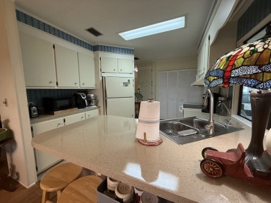Located in Rolling Greens Village, a 55+ community in Ocala on Rolling Greens Executive Golf Community in Florida - for sale on GolfHomes.com, golf home, golf lot