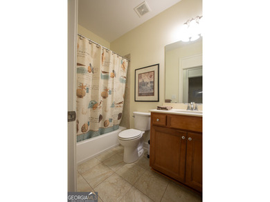 Welcome to easy, one-level living in this charming two-bedroom on Lanier Island Legacy Golf Couorse in Georgia - for sale on GolfHomes.com, golf home, golf lot