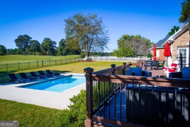 Overlooking the 17th green and inground pool, this gem is on Oak Mountain Championship Golf Club in Georgia - for sale on GolfHomes.com, golf home, golf lot