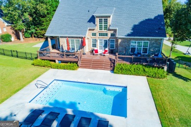 Overlooking the 17th green and inground pool, this gem is on Oak Mountain Championship Golf Club in Georgia - for sale on GolfHomes.com, golf home, golf lot