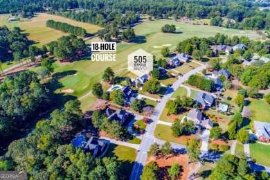 Overlooking the 17th green and inground pool, this gem is on Oak Mountain Championship Golf Club in Georgia - for sale on GolfHomes.com, golf home, golf lot