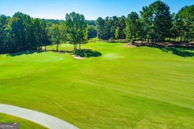 Overlooking the 17th green and inground pool, this gem is on Oak Mountain Championship Golf Club in Georgia - for sale on GolfHomes.com, golf home, golf lot