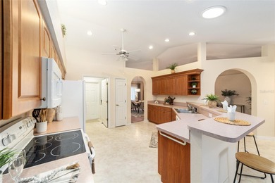 Welcome to effortless Florida living in this beautifully on Eagle Ridge At Spruce Creek Country Club in Florida - for sale on GolfHomes.com, golf home, golf lot