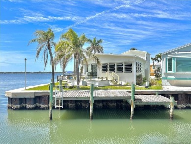 WATER, WATER EVERYWHERE! A RARE FIND--53 FEET OF OPEN WATER on Island Dunes Country Club in Florida - for sale on GolfHomes.com, golf home, golf lot