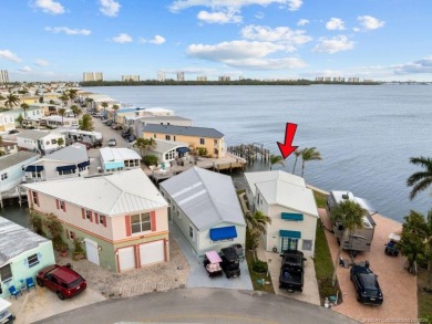 WATER, WATER EVERYWHERE! A RARE FIND--53 FEET OF OPEN WATER on Island Dunes Country Club in Florida - for sale on GolfHomes.com, golf home, golf lot