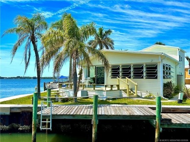 WATER, WATER EVERYWHERE! A RARE FIND--53 FEET OF OPEN WATER on Island Dunes Country Club in Florida - for sale on GolfHomes.com, golf home, golf lot