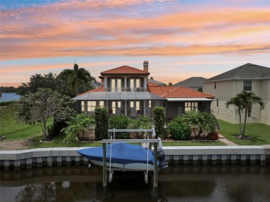 THIS HOME IS A  SUPER HERO that bravely fought the summer on Tarpon Springs Golf Course in Florida - for sale on GolfHomes.com, golf home, golf lot