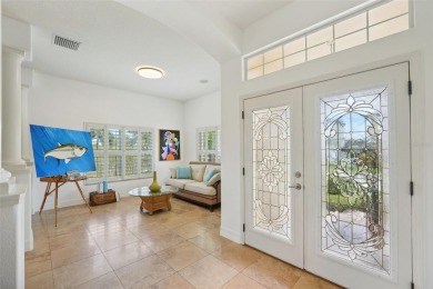 THIS HOME IS A  SUPER HERO that bravely fought the summer on Tarpon Springs Golf Course in Florida - for sale on GolfHomes.com, golf home, golf lot