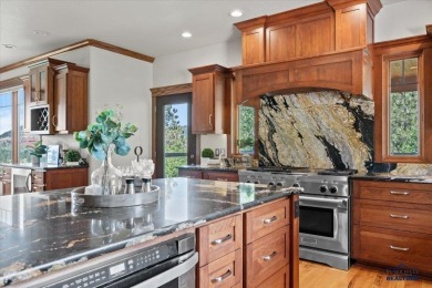 Tucked into nearly 3 acres of mature trees and peaceful hills on Spearfish Canyon Country Club in South Dakota - for sale on GolfHomes.com, golf home, golf lot