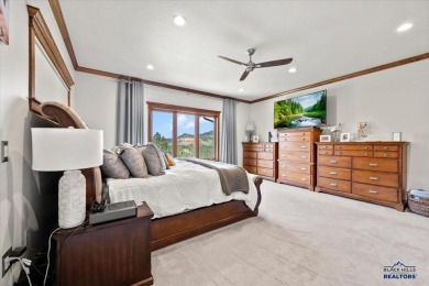 Tucked into nearly 3 acres of mature trees and peaceful hills on Spearfish Canyon Country Club in South Dakota - for sale on GolfHomes.com, golf home, golf lot