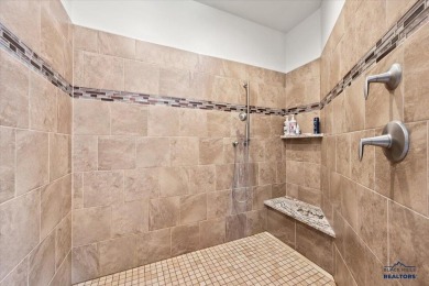 Tucked into nearly 3 acres of mature trees and peaceful hills on Spearfish Canyon Country Club in South Dakota - for sale on GolfHomes.com, golf home, golf lot