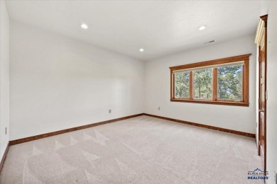Tucked into nearly 3 acres of mature trees and peaceful hills on Spearfish Canyon Country Club in South Dakota - for sale on GolfHomes.com, golf home, golf lot