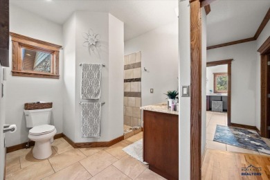 Tucked into nearly 3 acres of mature trees and peaceful hills on Spearfish Canyon Country Club in South Dakota - for sale on GolfHomes.com, golf home, golf lot