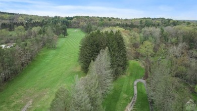 Own a piece of history with this unique mid-century modern on Winding Brook Country Club in New York - for sale on GolfHomes.com, golf home, golf lot