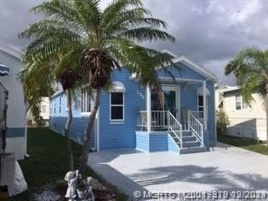 BEAUTIFUL, SPACIOUS CUSTOM SITE-BUILT (*STICK-BUILT*) 2 BEDROOM on Island Dunes Country Club in Florida - for sale on GolfHomes.com, golf home, golf lot