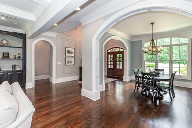 Gorgeous, stately all brick home situated on over an acre behind on Champions Retreat Golf Club in Georgia - for sale on GolfHomes.com, golf home, golf lot