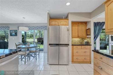 Located on the edge of Coral Springs FL, this unique home blends on The Carolina Club in Florida - for sale on GolfHomes.com, golf home, golf lot