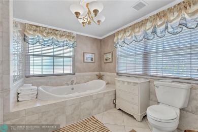 Located on the edge of Coral Springs FL, this unique home blends on The Carolina Club in Florida - for sale on GolfHomes.com, golf home, golf lot