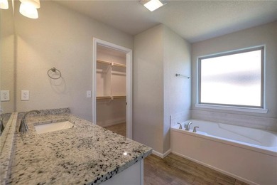 This affordable new home can be your first step to investing in on Heritage Park Golf Course in Kansas - for sale on GolfHomes.com, golf home, golf lot