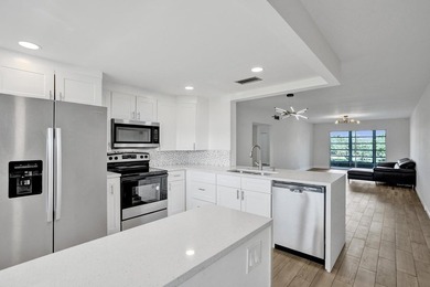 Discover this stunning top-floor 2-bed, 2-bath condo in the on Wynmoor Golf Course in Florida - for sale on GolfHomes.com, golf home, golf lot