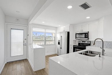 Discover this stunning top-floor 2-bed, 2-bath condo in the on Wynmoor Golf Course in Florida - for sale on GolfHomes.com, golf home, golf lot